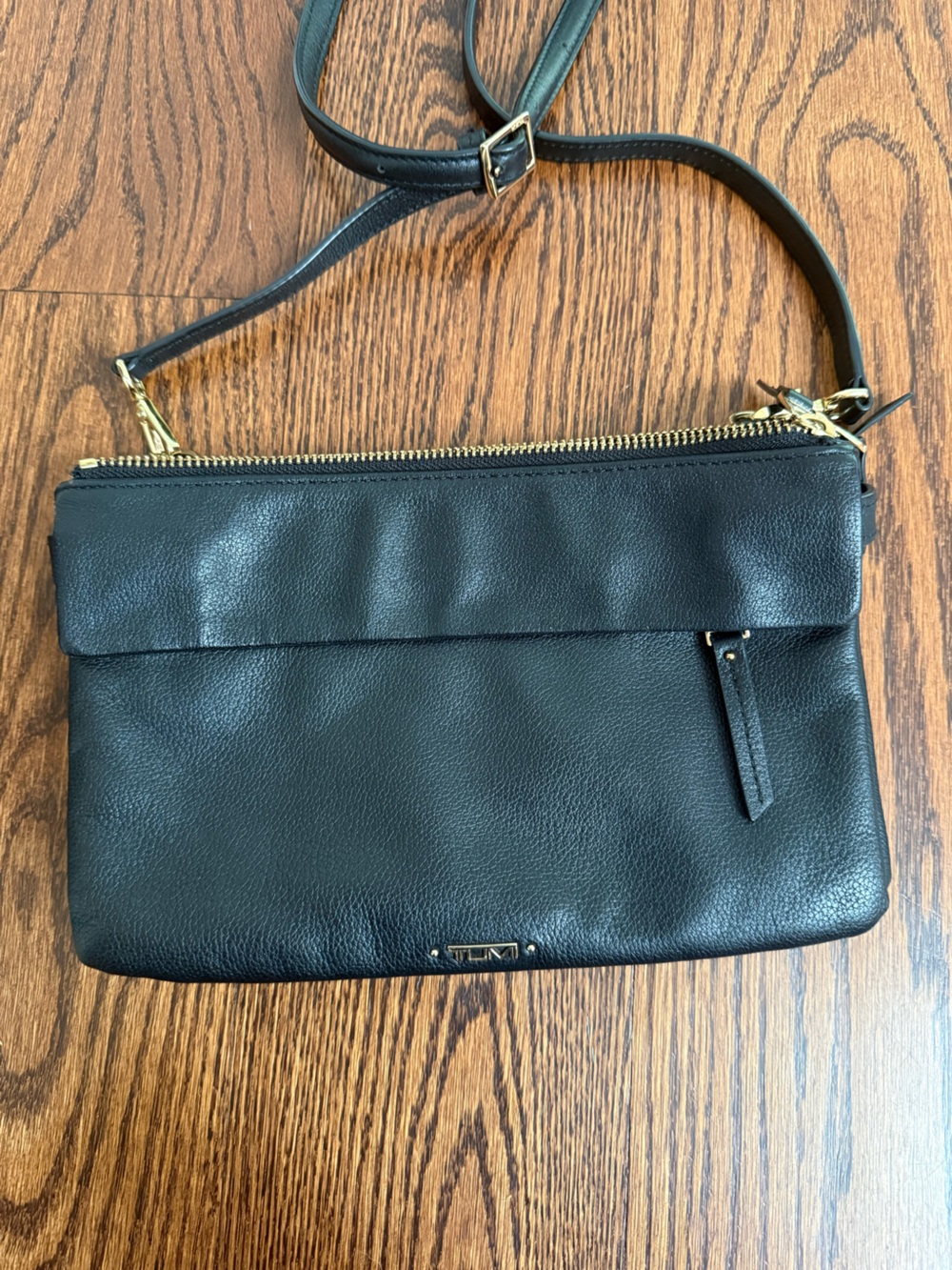 TUMI Black Leather crossbody with Gold Hardware